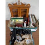 Two boxes containing miscellanea including commemorative chine, 20th century annuals, binoculars,