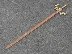 A decorative brass handled sword
