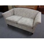 A late 20th century two seater settee