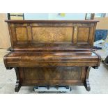 An antique walnut cased piano by Bishop & Son
