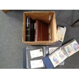 A box containing loose 20th century world stamps and albums containing First Day Covers