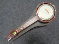 A 20th century four string banjo ukulele in hard carry case