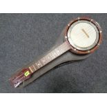 A 20th century four string banjo ukulele in hard carry case
