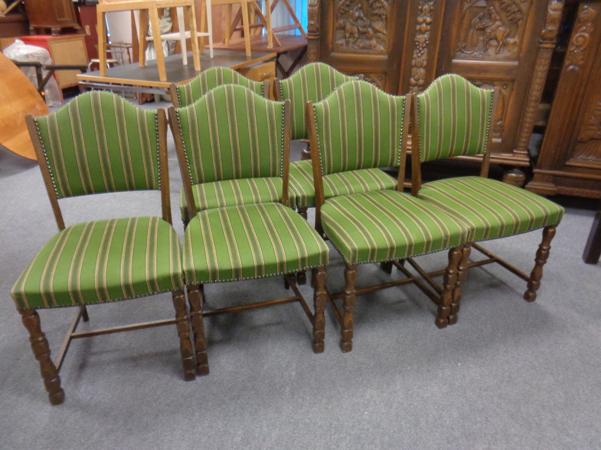 A set of six beech dining chairs in studded striped upholstery