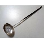 A 19th century silver toddy ladle inset with a coin