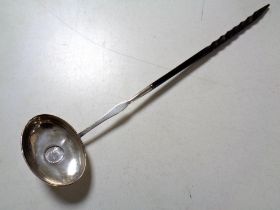 A 19th century silver toddy ladle inset with a coin