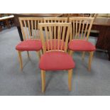 A set of four contemporary dining chairs