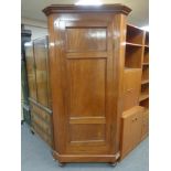 A late 19th century mahogany corner cabinet with shelved interior