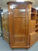 A late 19th century mahogany corner cabinet with shelved interior