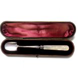 A silver and mother-of-pearl handled cheese scoop in fitted case