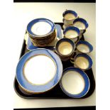 A tray of 37 pieces of Paragon blue and gilt tea china