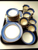 A tray of 37 pieces of Paragon blue and gilt tea china