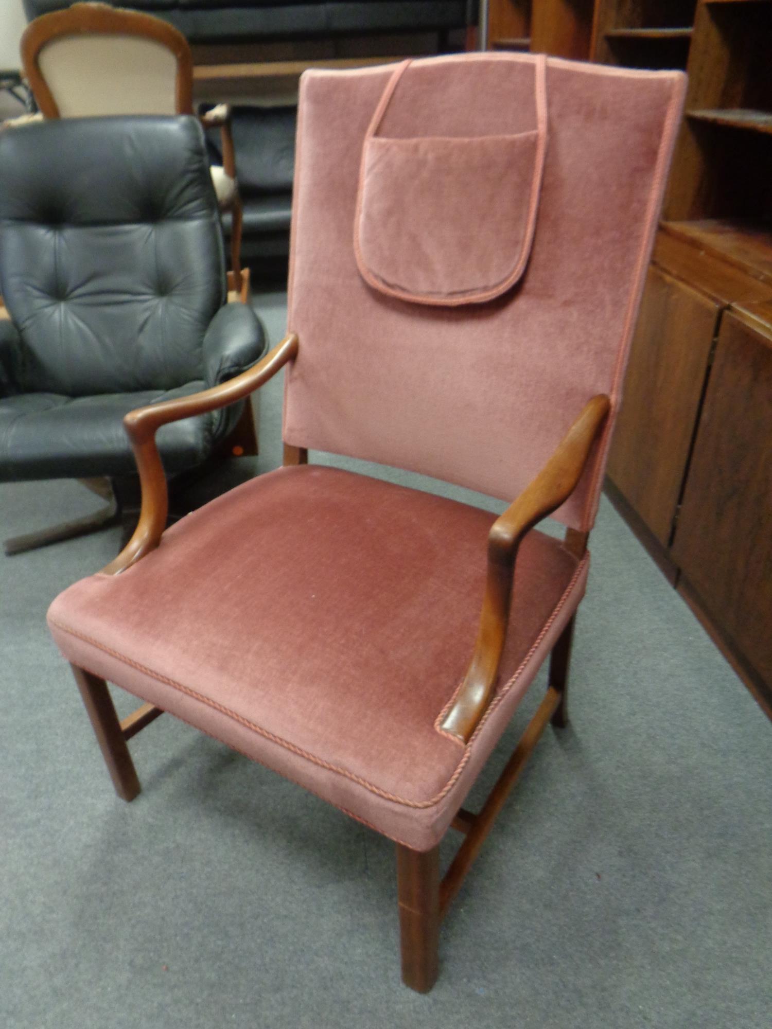 A continental beech framed armchair upholstered in pink Dralon