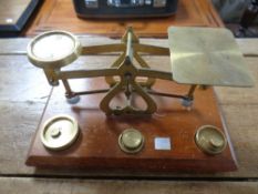 An antique set of postal scales with brass weights