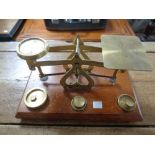 An antique set of postal scales with brass weights