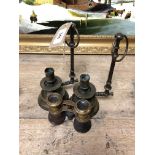 A pair of brass candlesticks and a small pair of binoculars