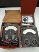 A tray of two Universal volt meters and a Micronta Ohms / Volt multi tester