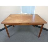 A 20th century teak pullout dining table