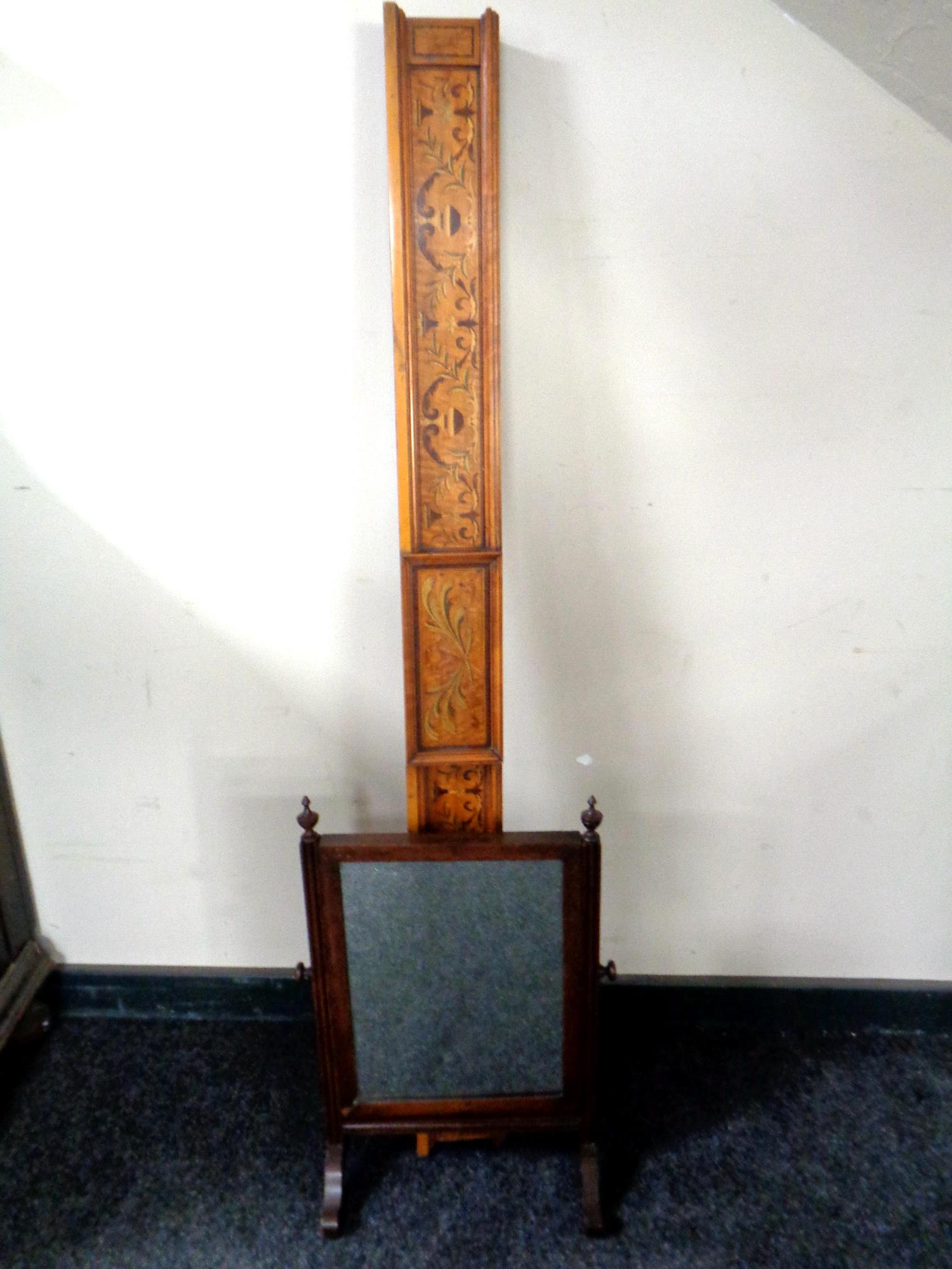 A Victorian dressing table mirror with an inlaid pediment