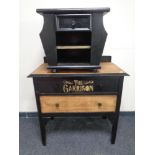 An oak two drawer chest and magazine rack with 'The Garrison Shelby Brothers' decoration