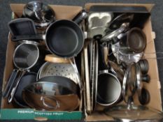 Two boxes of stainless steel kitchenware including pans etc