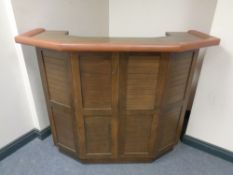 A beech and brown leather bar counter