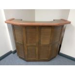 A beech and brown leather bar counter