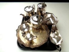 A tray of stainless steel tea set, silver plated circular tray,