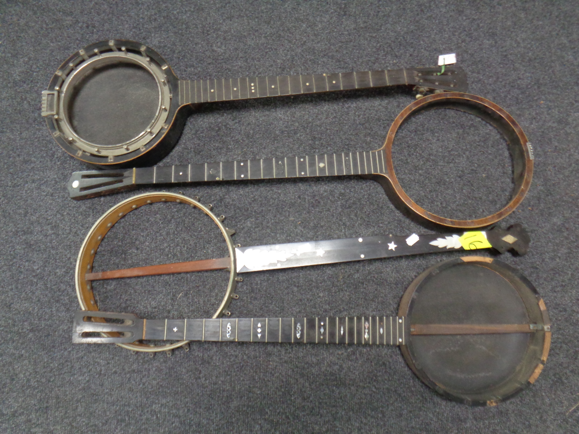A box of four banjo bodies (for restoration)
