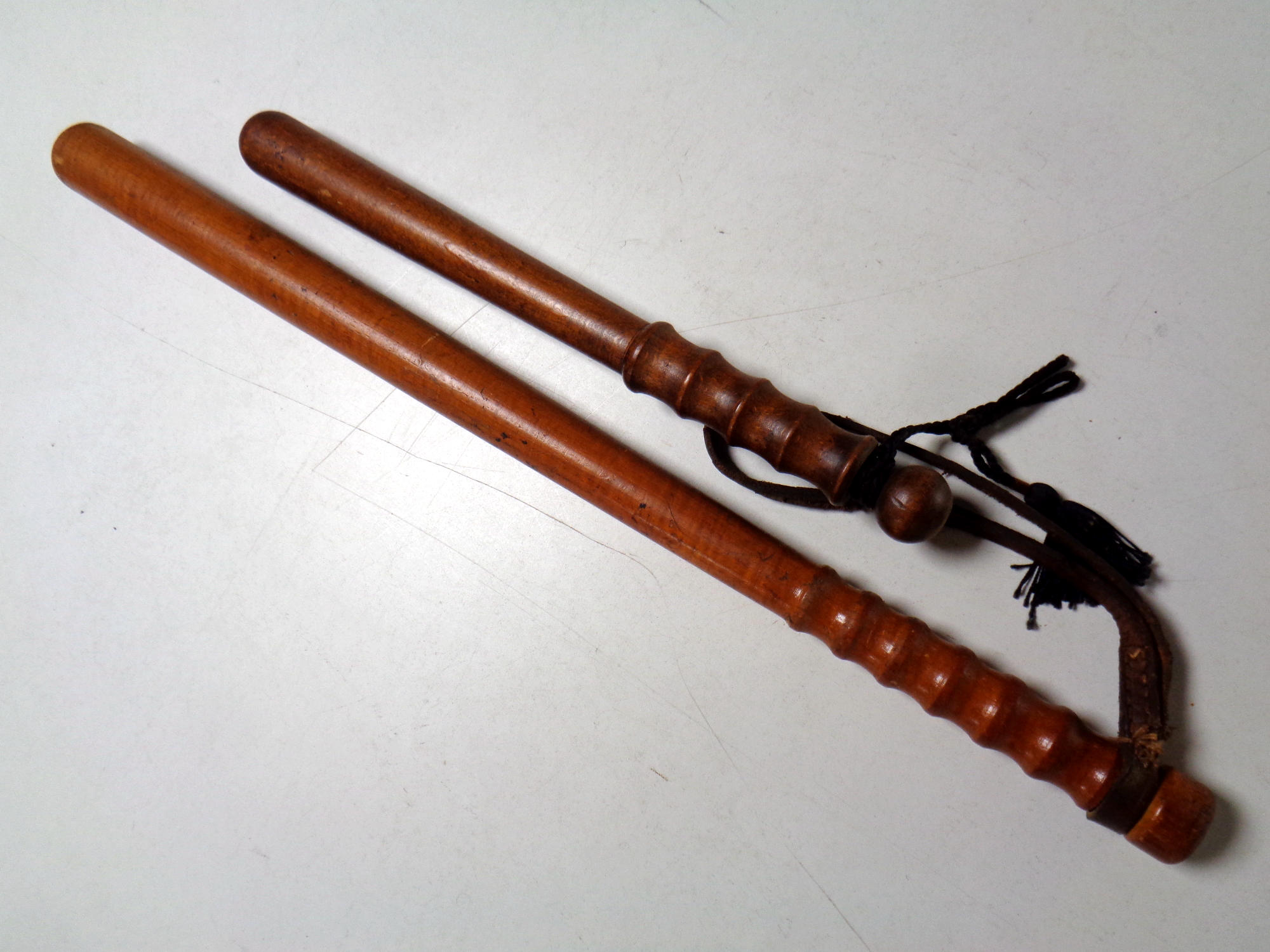 Two turned wooden truncheons