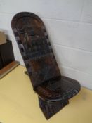 An African carved fertility chair