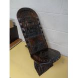 An African carved fertility chair