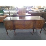 A Regency style mahogany sideboard fitted with cupboards and drawers