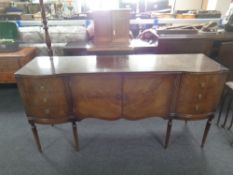 A Regency style mahogany sideboard fitted with cupboards and drawers