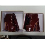 A pair of Onlymaker Burgundy painted leather stiletto boots (size US 8)