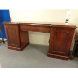 A Victorian mahogany inverted break fronted pedestal sideboard