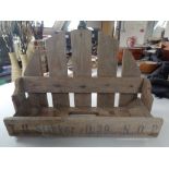 A small rustic pine wall rack