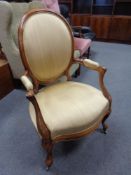 A 19th century walnut salon chair in gold upholstery