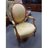 A 19th century walnut salon chair in gold upholstery