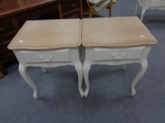 A pair of Laura Ashley painted oak single drawer bedside tables on cabriole legs