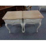 A pair of Laura Ashley painted oak single drawer bedside tables on cabriole legs