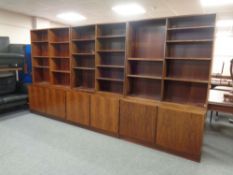 A 20th century rosewood veneer three part book case with fitted cupboards beneath (As found)