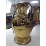 A brass coal bucket and a brass stick stand