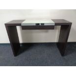 A contemporary dressing table with mirrored top