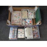 A box containing a large quantity of world stamps loose and in albums with British stamps