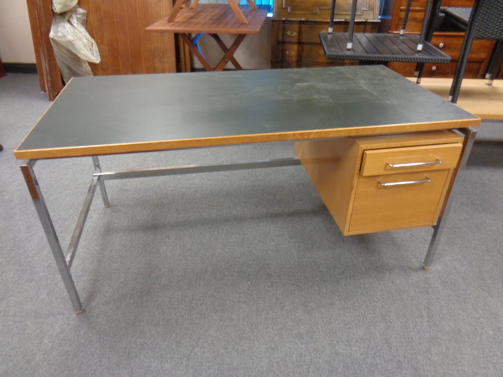 A late 20th century continental chrome and oak writing desk with two fitted drawers