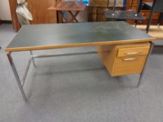 A late 20th century continental chrome and oak writing desk with two fitted drawers