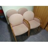 A set of four beech framed office armchairs