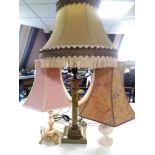 A brass and onyx table lamp with two others