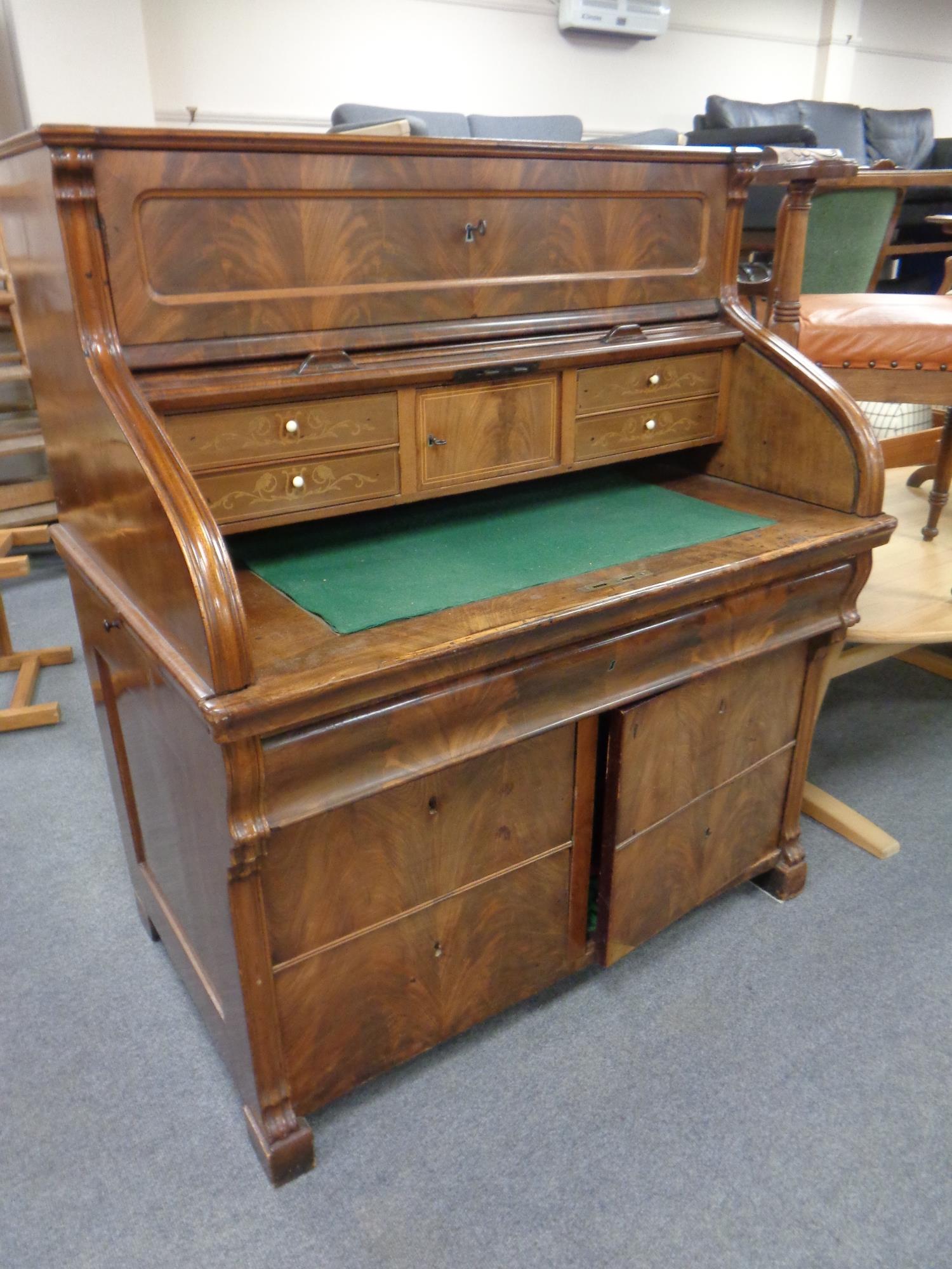 A 19th century inlaid mahogany roll-top writing bureau